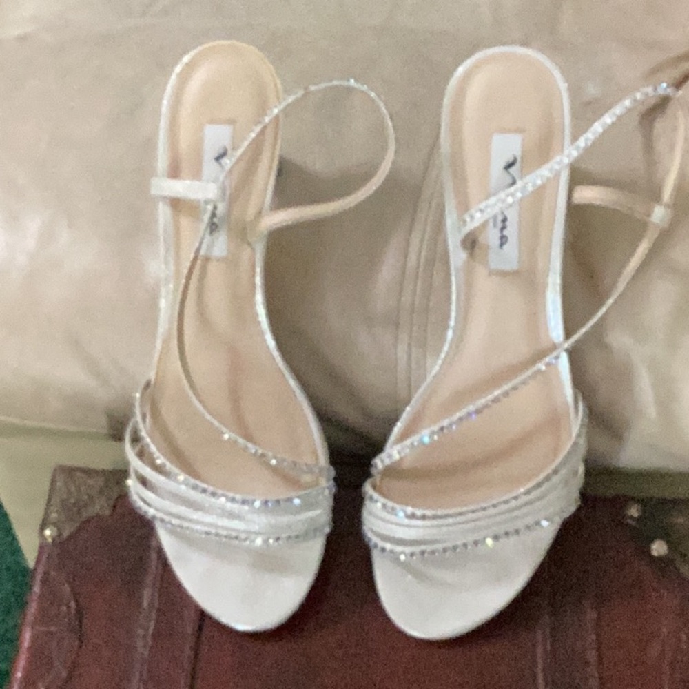 NINA New York, shiny silver, dressy, strappy heels. silver sparkles straps.